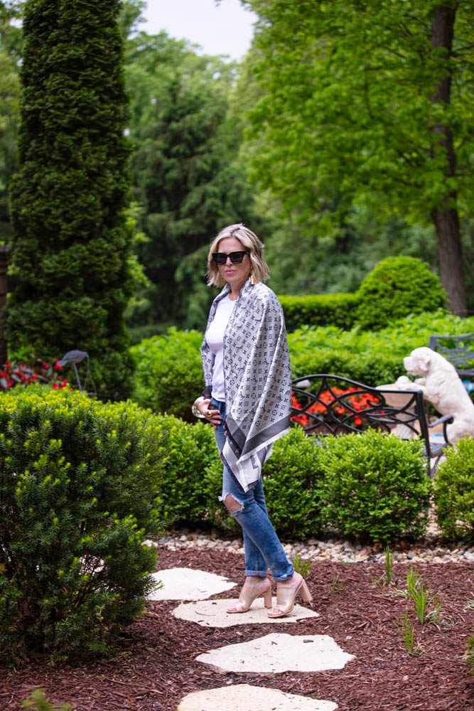 How to Afford Luxury Items when shopping in Italy featured by top US life and style blogger, Dawned on Me: image of a woman wearing a Louis Vuitton Monogrammed Shawl