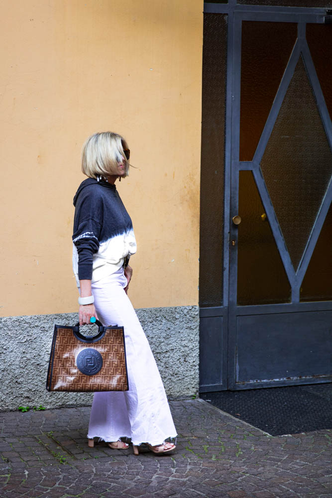 How to Afford Luxury Items when shopping in Italy featured by top US life and style blogger, Dawned on Me: image of a woman wearing a Fendi Runaway Shopper Bag