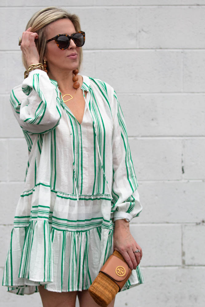 Cute spring outfit ideas under $50 featured by top US fashion blogger, Dawned on Me: image of a woman wearing an ASOS striped smock dress