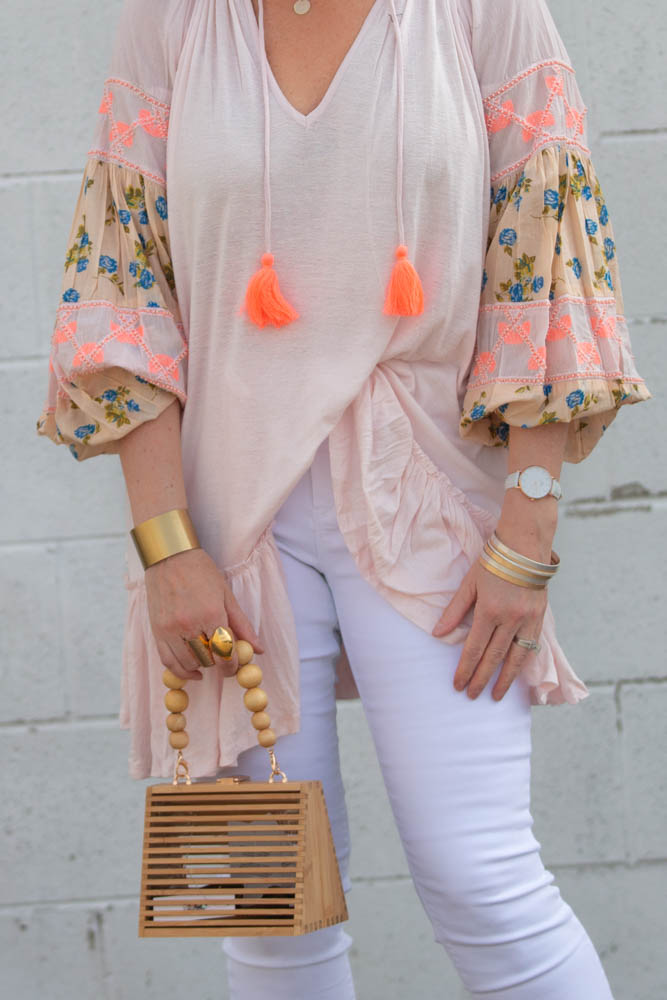 Cute spring outfit ideas under $50 featured by top US fashion blogger, Dawned on Me: image of a woman wearing an ASOS beaded bamboo bag