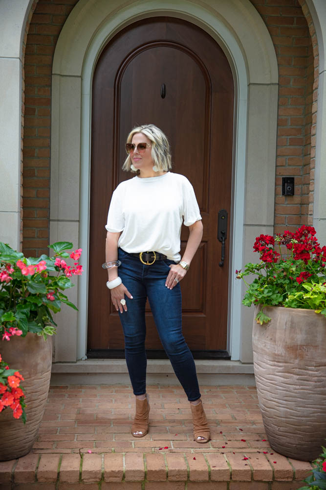 Top 5 Best White T Shirts For Women featured by top US fashion blogger, Dawned on Me: image of a woman wearing a Free People cuffed sleeved white t shirt